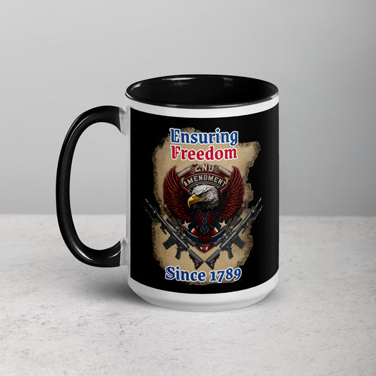 Ensuring Freedom 15 oz Mug by Awake Republic - White with black colored rim, inside, and handle. Ceramic mug is dishwasher and microwave safe with colorful images